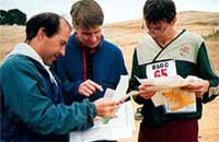 Steve Gregg, Tapio Karras, and Werner Haag compare split times on Red at the Morgan Territory A-meet, Oct. 2001 (Photo: Judy Koehler)