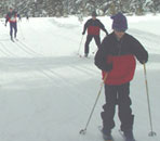 Tapio Karras and his sons finishing the Orange course at the 2004 Bear Valley Ski-O (Photo: Tony Pinkham)
