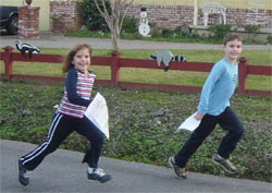 Max and Victoria at the Emerald Hills Street-O in 2003, after answering the question "How many skunks on the fence?"