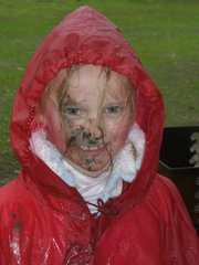 Course 1 winner Hannah Kopisch shows that a face plant in the mud didn't slow her down.